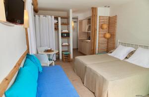 Posteľ alebo postele v izbe v ubytovaní Apartamentos Sabina Playa