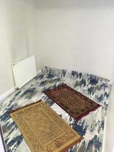 two mats on the floor in a room at Petrol-İş İstanbul Misafirhanesi in Istanbul