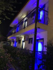 a building with blue lights on the side of it at Rota Hotel in Dalyan