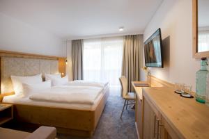 Postel nebo postele na pokoji v ubytování Boutiquehotel Hohes Licht + 37 fotografií
