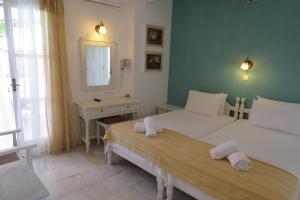 Krevet ili kreveti u jedinici u okviru objekta Corali Beach Hotel
