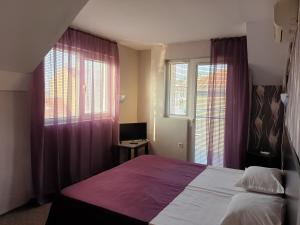 Postel nebo postele na pokoji v ubytování Guest House Taligarov
