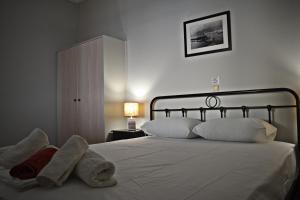 Posteľ alebo postele v izbe v ubytovaní Tinos View Apartments
