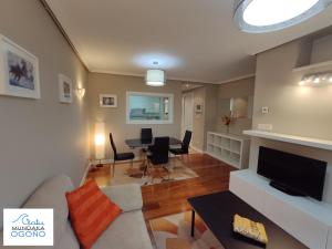 a living room with a couch and a table at Apartamento Ogoño in Mundaka