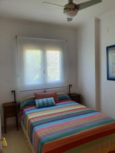 Posteľ alebo postele v izbe v ubytovaní Fantastico bajo con Jardin en Playa de Canet