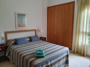 Posteľ alebo postele v izbe v ubytovaní Fantastico bajo con Jardin en Playa de Canet