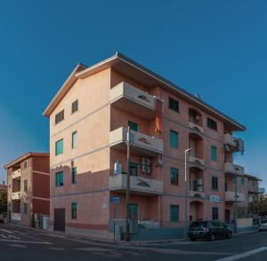 a building on the side of a street at R&B mediterraneo in Bosa