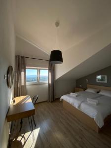 Postel nebo postele na pokoji v ubytování Penthouses Panorama