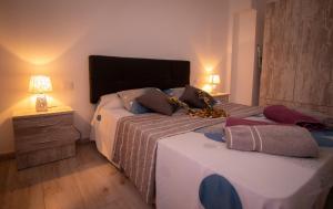 Postel nebo postele na pokoji v ubytování EL CARMEN beach apartment + 37 fotografií