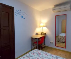 Postel nebo postele na pokoji v ubytování Apartamentos Capuchinas