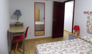 Postel nebo postele na pokoji v ubytování Apartamentos Capuchinas