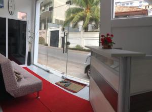 a living room with a red carpet and a window at WISH RESIDENCE SeaSide, Near Durdans & Vasan eye care Hospital, Colombo 3 in Colombo
