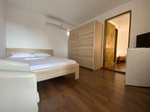 Postel nebo postele na pokoji v ubytování Casa Ciobi