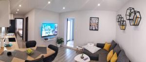 a living room with a couch and a table at Apartment Skavo in Baška Voda