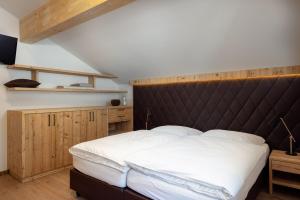Łóżko lub łóżka w pokoju w obiekcie CHALET MONTIS