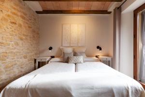 A bed or beds in a room at El Gresol - Naturaleza y Relax