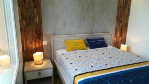 Кровать или кровати в номере Appartement l'Estivalière face à la mer