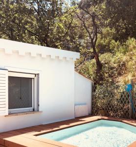 a swimming pool in the backyard of a house at Villa Don Giovanni Taormina Mare in Taormina