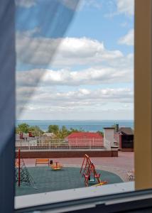 a view of a playground from a window at Atmosfera Hotel in Odesa