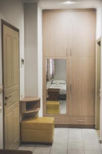a room with a door leading to a bedroom at Stefania Studios by Estia in Stalís