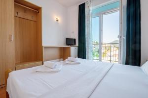 Postel nebo postele na pokoji v ubytování Motel Jadranka