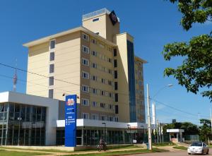 a building with a clock tower on top of it at Hotel 10 Palmas in Palmas