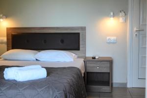 Postel nebo postele na pokoji v ubytování Kalouda Rooms