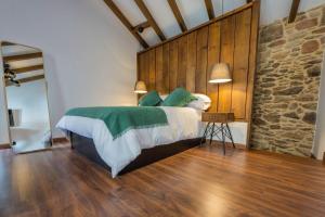 Postel nebo postele na pokoji v ubytování Casa Xiana