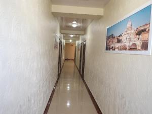 a long hallway with a painting on the wall at Гостевой дом RIVA Джемете in Anapa