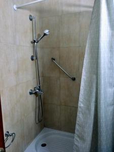 a shower with a shower curtain in a bathroom at Apartamentos Montemar in Playa del Ingles +22 photos
