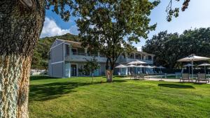 a view of the house from the yard at KARAVOS in Almiros Beach