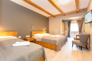 Posteľ alebo postele v izbe v ubytovaní Hotel Landhaus Lungau