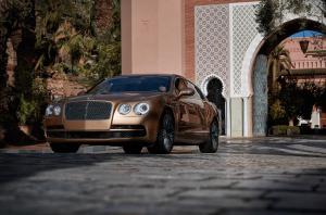 a brown car parked in front of a building at Royal Mansour Marrakech in Marrakesh