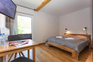 Posteľ alebo postele v izbe v ubytovaní Hotel Landhaus Lungau