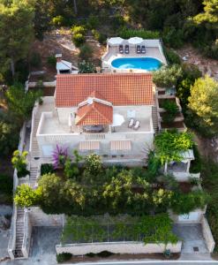 an aerial view of a house with a swimming pool at Villa Katja in Sumartin