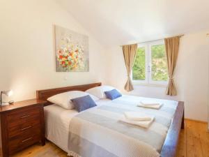 a bedroom with two beds and a window at Villa in Tu epi with Private Swimming Pool in Tučepi