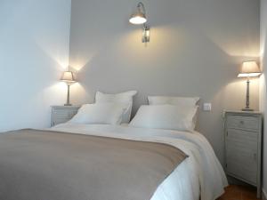 En eller flere senge i et værelse på La Ferme des 5 Chemins
