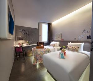 Postel nebo postele na pokoji v ubytování ARTOTEL Thamrin Jakarta + 26 fotografií