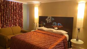 Katil atau katil-katil dalam bilik di Villa Park Motel