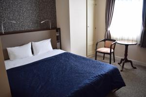 Postel nebo postele na pokoji v ubytování Asakusa Central Hotel