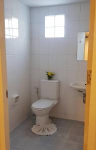 a bathroom with a toilet and a sink at Sena House Lamlukka Klong2 in Pathum Thani
