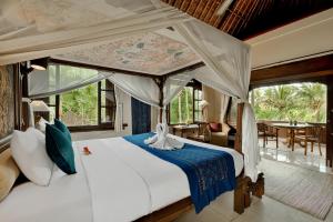 Postel nebo postele na pokoji v ubytování Alam Shanti Ubud