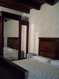 Postel nebo postele na pokoji v ubytování Agriturismo Cascina Gilli