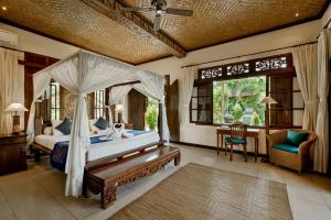 Postel nebo postele na pokoji v ubytování Alam Shanti Ubud