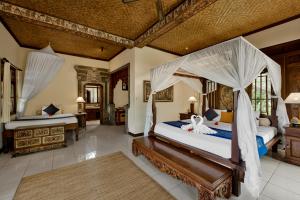 Postel nebo postele na pokoji v ubytování Alam Shanti Ubud