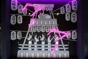un cartel de un grupo de personas en un escenario en HOTEL TAVINOS Asakusa, en Tokio