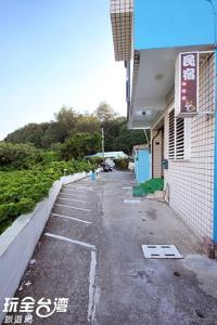 an empty parking lot in front of a building at Ludao B&B in Green Island