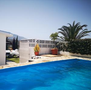 a swimming pool in the backyard of a house at Casitas Las Pereras in Los Llanos de Aridane