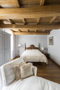 a bedroom with a large bed and a couch at Residenza Farnese in Farnese