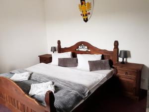 Postel nebo postele na pokoji v ubytování Hotel Camelot
